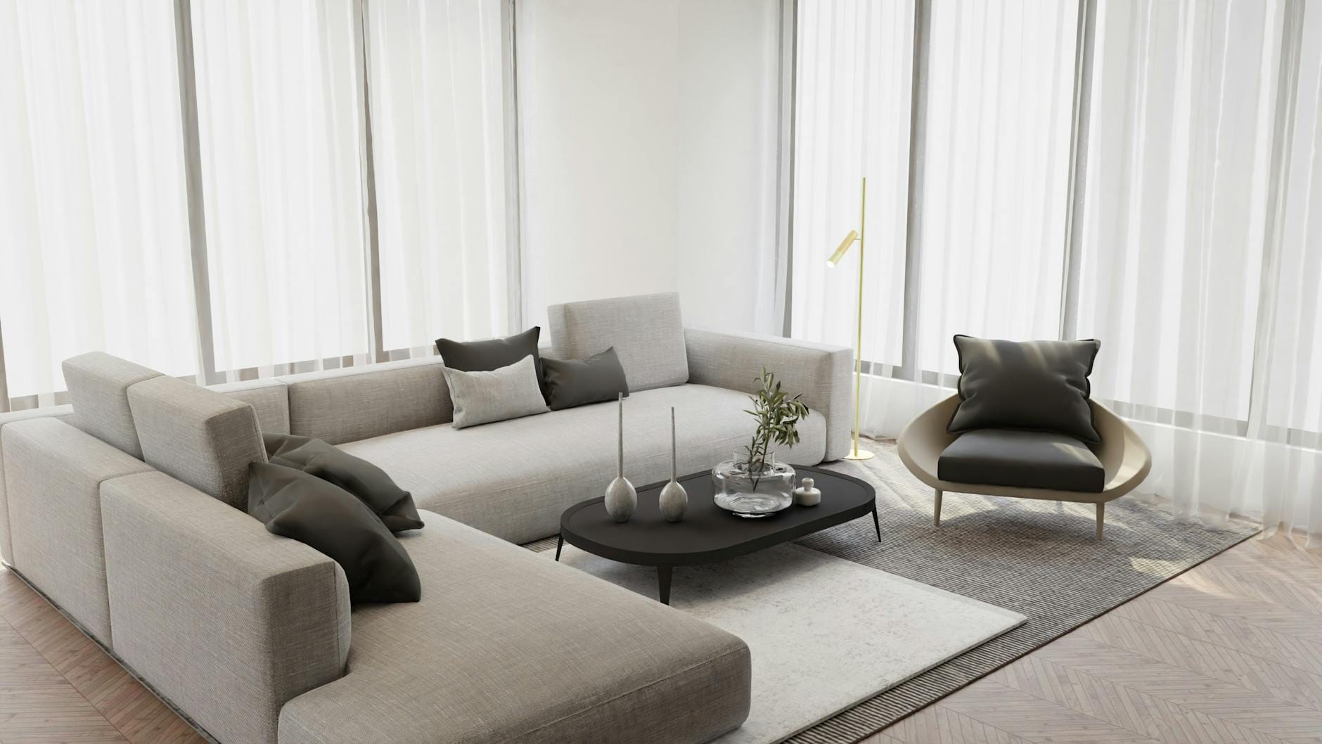 Minimalistyczny salon w stylu skandynawskim z szarą sofą i fotelem